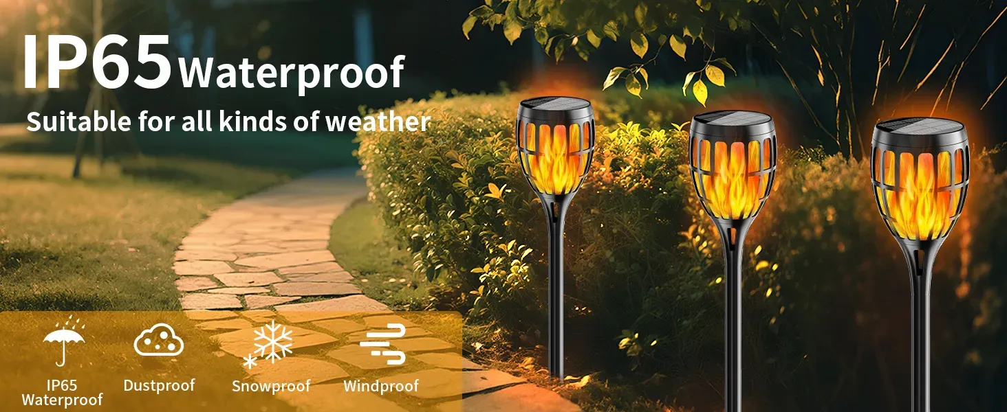 Close-up of solar torch light with flickering flame effect at night