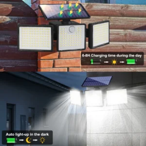 Black solar wall light outdoor lamp glowing warmly on wooden fence