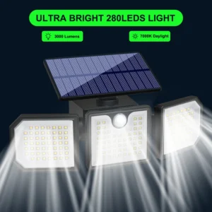 Black solar wall light fixture glowing on garden fence at night