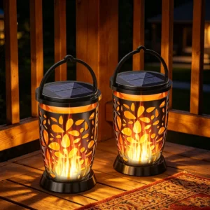 two black solar flame lanterns placed on wooden deck, warm flickering flame light for patio.