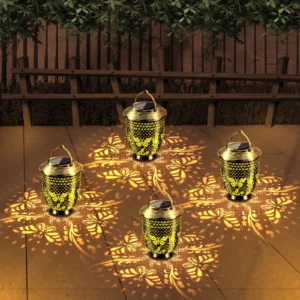multiple bronze metal butterfly solar projection lanterns placed on patio.
