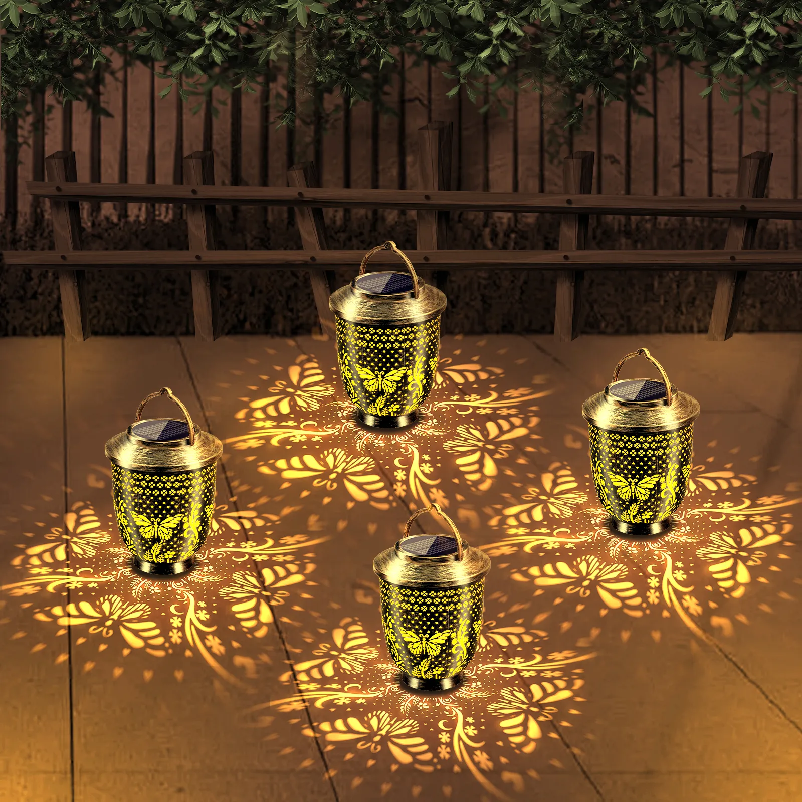multiple bronze metal butterfly solar projection lanterns placed on patio.