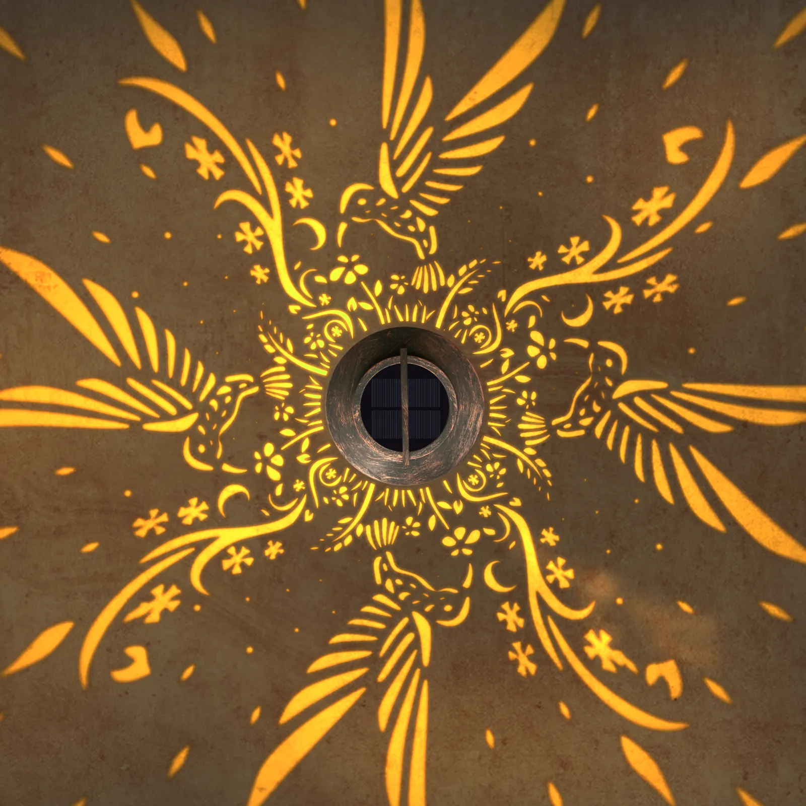 close‑up view of bird flower projection pattern from antique‑bronze solar hanging lantern.