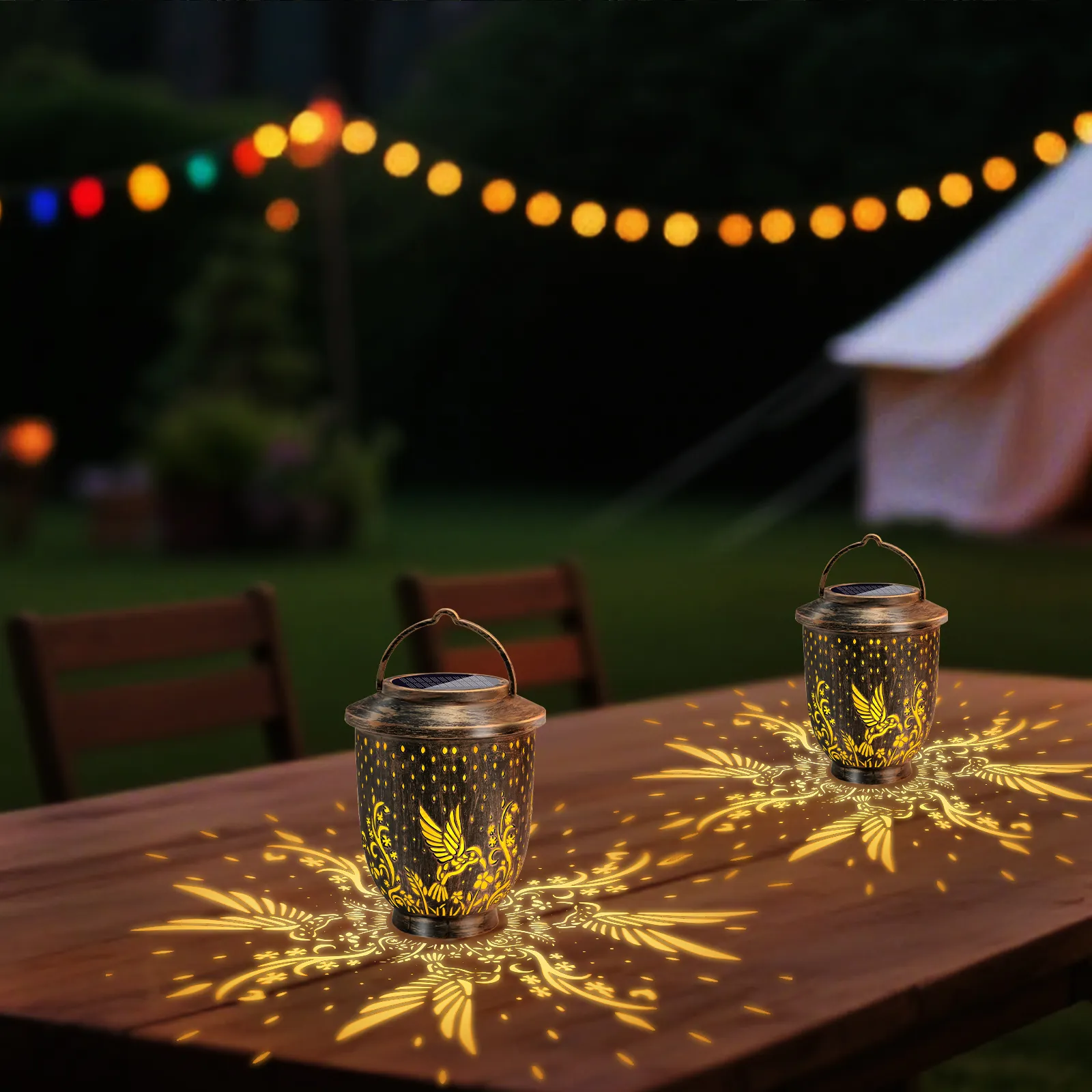 solar bird projection lanterns placed on wooden table, perfect decor for patio garden camping evening party.